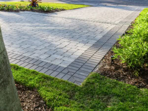 two piece cobble paved driveway with thick interlocking concrete pavers