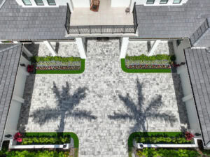 arial photo of paved driveway with thick interlocking concrete pavers