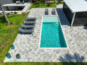 arial photo of concrete pavers pool deck