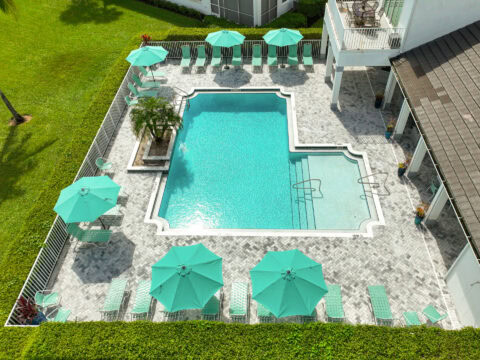 arial photo of paved pool deck by accurate pavers
