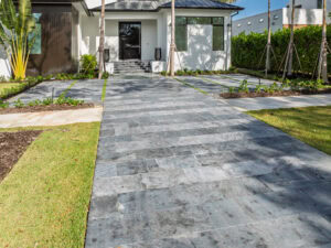 front of the house driveway with turf inserts by accurate pavers - naples paving contractor company