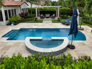 pool area deck in travertine by accurate pavers