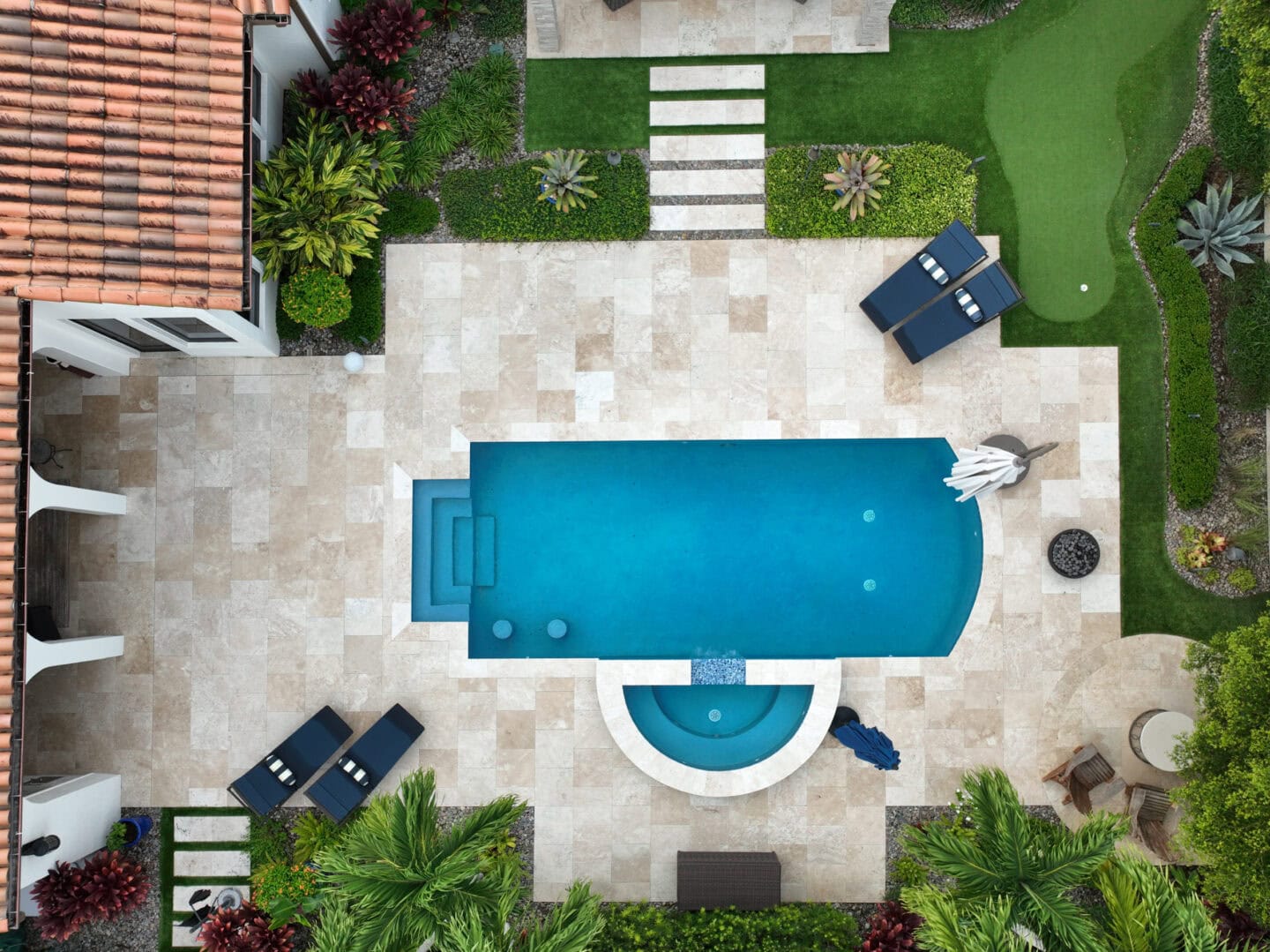 aerial photo of a pool deck by accurate pavers