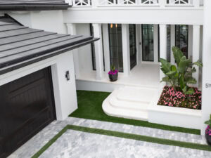paved driveway in naples with turf in by accurate pavers