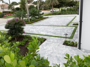 paved driveway in naples with turf in by accurate pavers