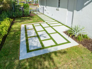 turf in walkway by accurate pavers