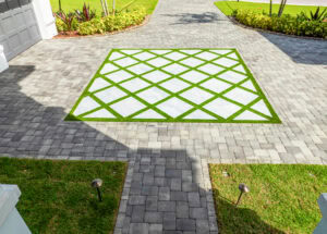 a stone walkway with grass turf in