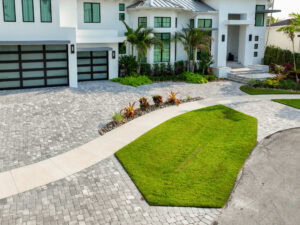 Modern house with landscaped driveway paved by accurate pavers