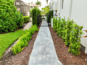 paved walkway leading to gated entrance.