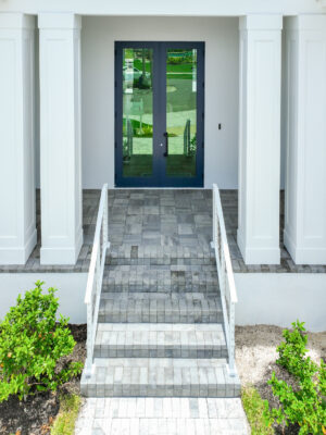 Modern entrance with stylish paved steps and risers