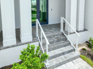 Modern entrance with stylish paved steps and risers