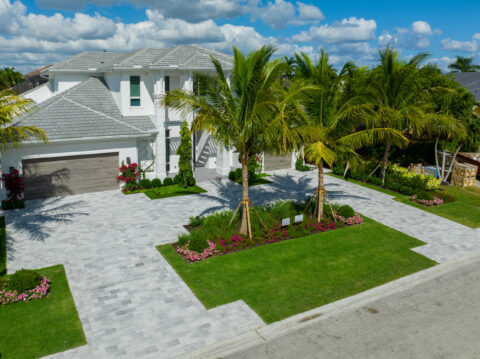 Modern house with paved driveway by accurate pavers