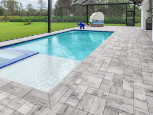 paved pool deck cleaned and sealed by accurate pavers