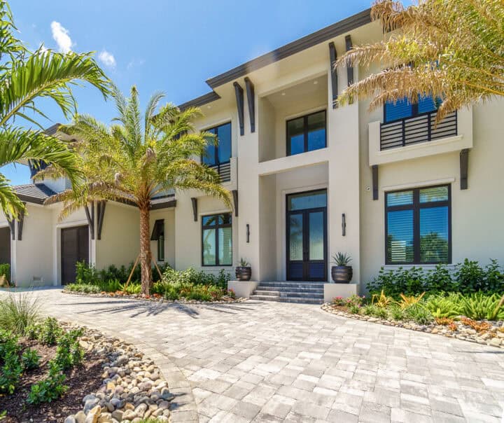 paver driveway project by accurate pavers with beautiful house in the background